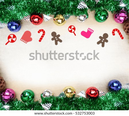 Christmas background with decorations on wooden board.