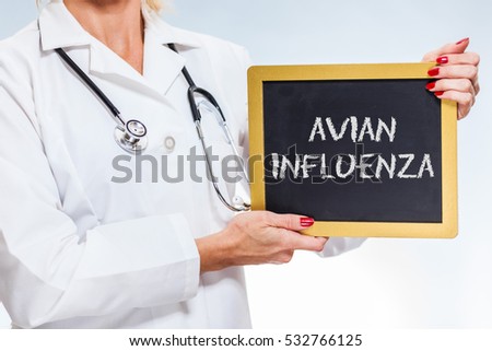 Avian Influenza Chalkboard Sign Held By Female Doctor.