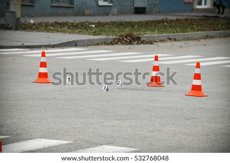 Road hazard cone on accident site 