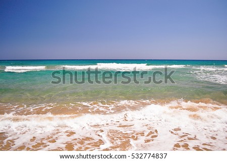 Sea blue bottom summer wave background. Vacation relax on the beach. The beautiful sandy beach of the Mediterranean Sea clean. Beautiful photo.