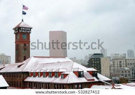 Cityscape view of Portland, Oregon and the train station during winter snow
