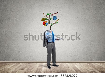 Faceless businessman in room with drawn growth concept instead of head