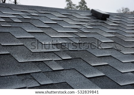 Close up view on asphalt roofing shingles  Royalty-Free Stock Photo #532839841