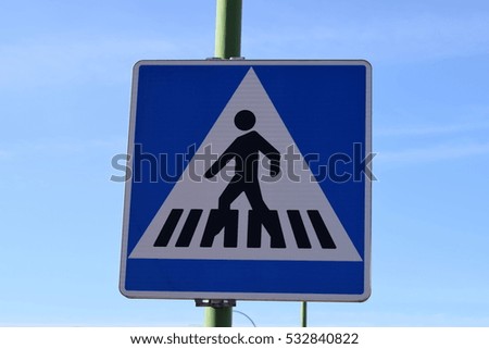 Road signs to cross a road.