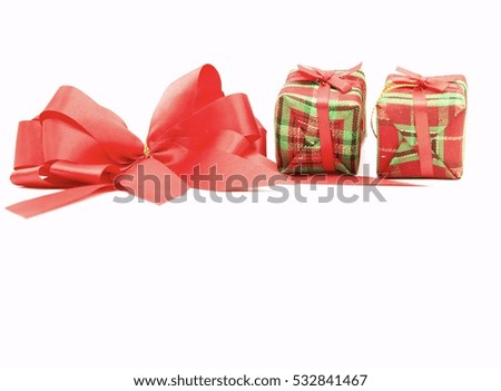 Red ribbon and gift boxes are on white background.