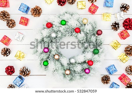 Christmas wreath with decoration on white wooden background. Copy space 