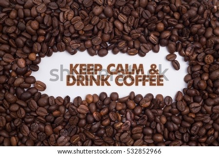 Background made of coffee beans with message "Keep Calm & Drink Coffee"