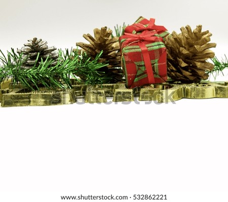 Christmas gift box and pine cone are on white background