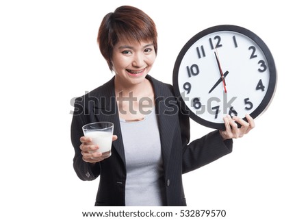 Healthy Asian woman drinking  glass of milk hold clock  isolated on white background.