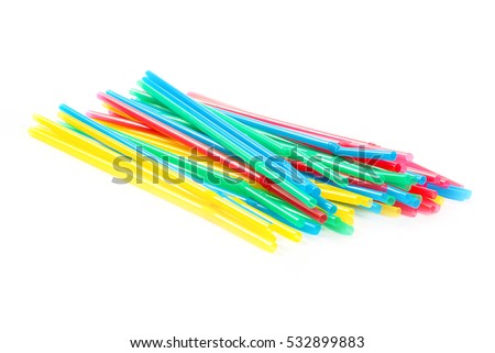 pile of plastic cocktail straws to consumption of drinks