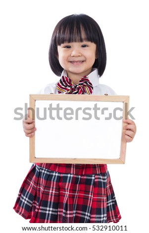 Happy Asian Chinese little student girl holding whiteboard in isolated white background.