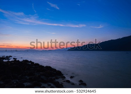 Beautiful colorful of sunset landscape view at beach located at south of thailand