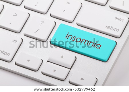 Insomnia word written on computer keyboard.