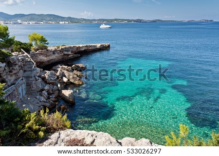 Beautiful secret bay at Ibiza. Luxury rest at Balearic Islands. Beautiful place for diving. Nature of the Mediterranean.