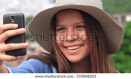 Pretty Female Teen Taking Selfy