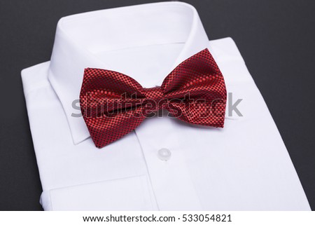 Color bow tie isolated on black background