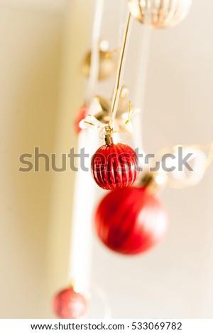 Christmas decoration, bright red balls on ribbon
