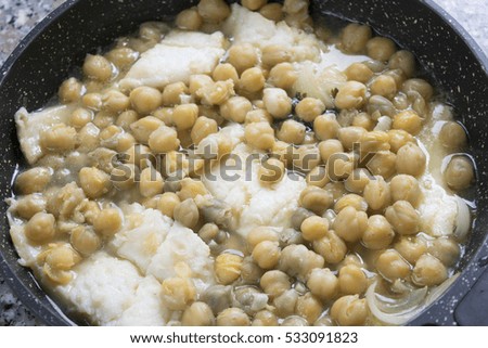 soup of salted codfish with chickpeas in pan