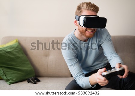 Handsome man enjoying games and  virtual reality