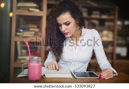 Female student studying on tablet for university