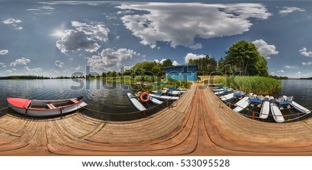 360 panorama on boat station on lake in sunny day. Full 360 by 180 degrees angle seamless panorama view. Skybox as background in equirectangular spherical equidistant projection for VR AR content Royalty-Free Stock Photo #533095528