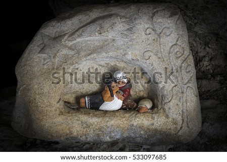 Italy, Cessapalombo-January 5, 2015: exhibition of nativity scenes in the cave depicting the nativity picture ceramic nativity scene inside a a carved stone, a symbol of Christmas