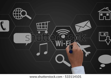 Businessman drawing the virtual panel of icon polygon interface of wifi ,Computer network concept
