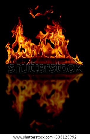 fire flames background with reflection on a black 