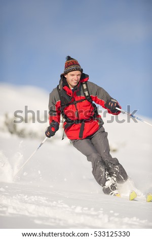 Happy skier in action skiing