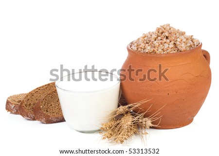 pot with porridge and milk