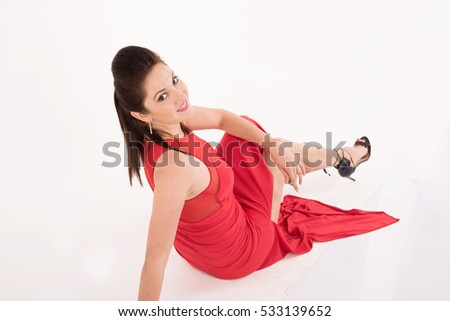 young pretty woman happy smiling and sitting on the floor