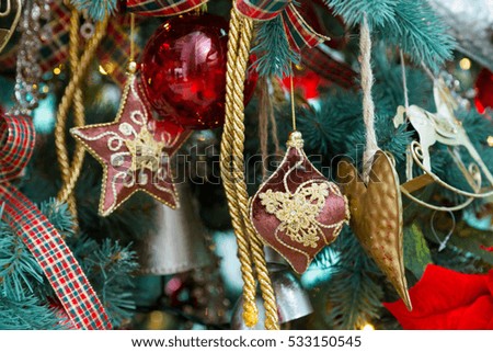 Ornaments on the Christmas tree. Toys on the Christmas tree