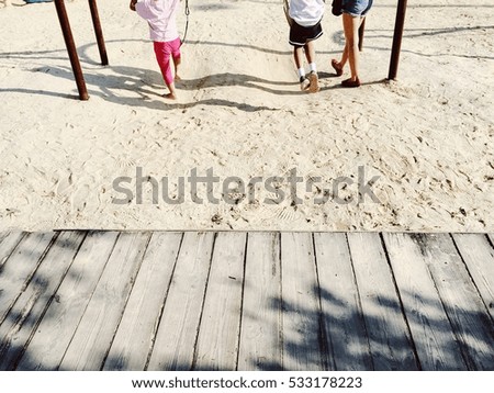 Happy kid on swing enjoy freedom and summer 