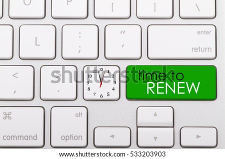 Time to renew word written on computer keyboard.