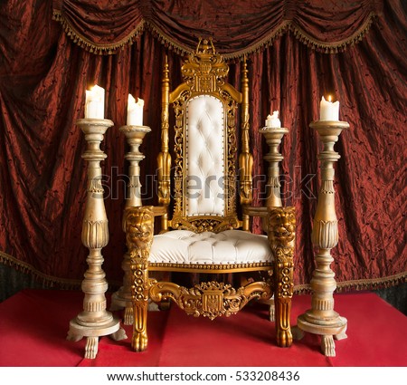 Royal throne of gold on red curtain background Royalty-Free Stock Photo #533208436