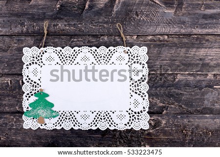 Pure white napkin with a Christmas tree on a wooden, vintage look background