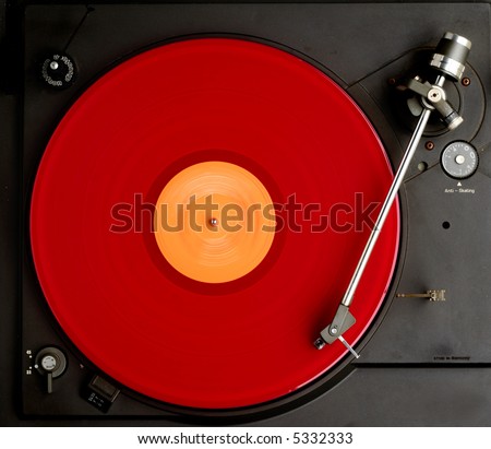 red album turning on black recordplayer Royalty-Free Stock Photo #5332333