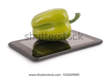 Green peppers on a tablet PC. Photo with clipping path