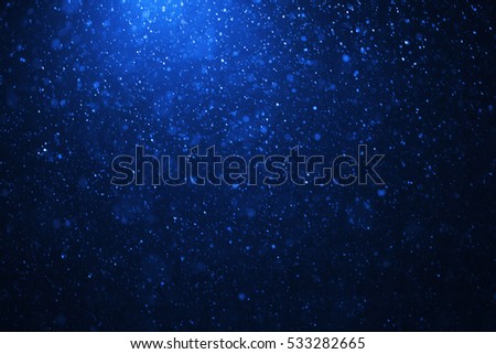 snowflakes on a blue evening sky