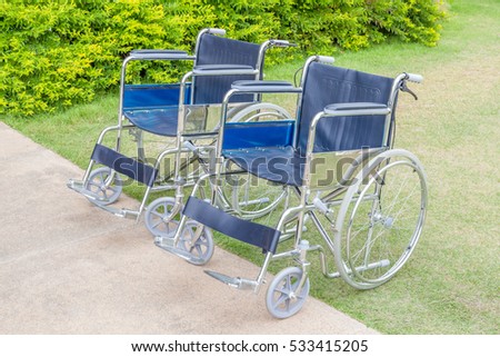 Empty wheelchairs service in the public park.