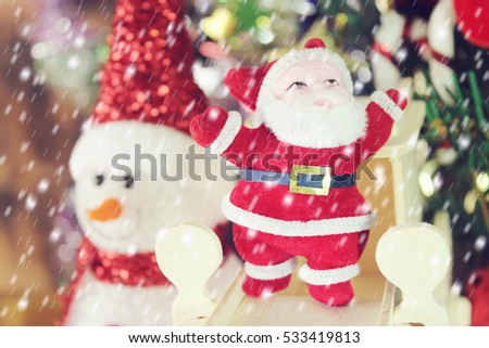 Christmas decoration santa claus and pine tree on the  snow with christmas background