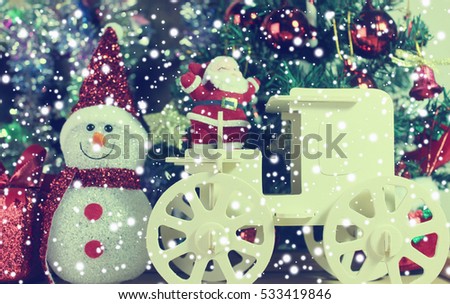 Christmas decoration santa claus and pine tree on the  snow with christmas background