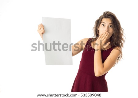 lovely brunette girl in red dress with white placard in hands isolated