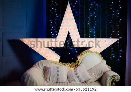 Decorative luminous star on the Christmas and New Year background