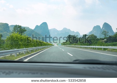 Driving through rice fields and karst scenery in Guangxi province, China