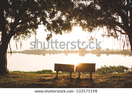 Park Bench in the Morning Light.Image contain certain grain or noise and soft focus.