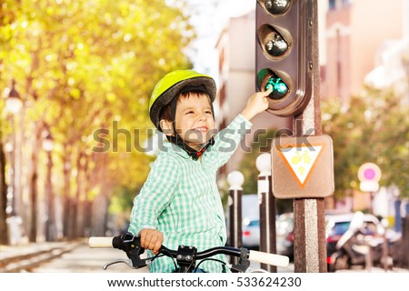 Boy cycling on his bike and learning traffic rules