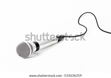 Silver handheld ball head microphone isolated on white background. Royalty-Free Stock Photo #533636359