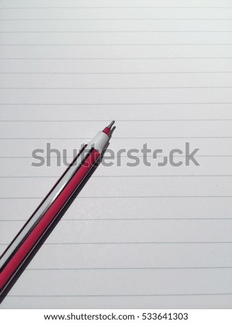Ball pen on the line paper with space to put text on vertical side
