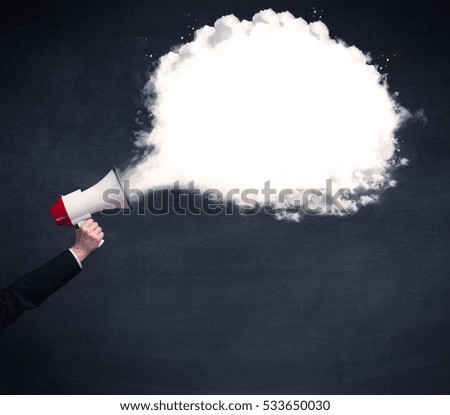 Caucasian business hand holding megaphone with white plain message cloud